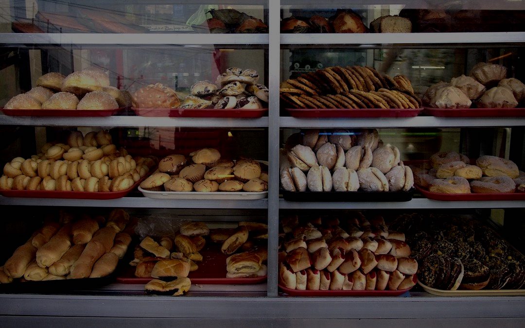 Filipino baked goods behind glass.
