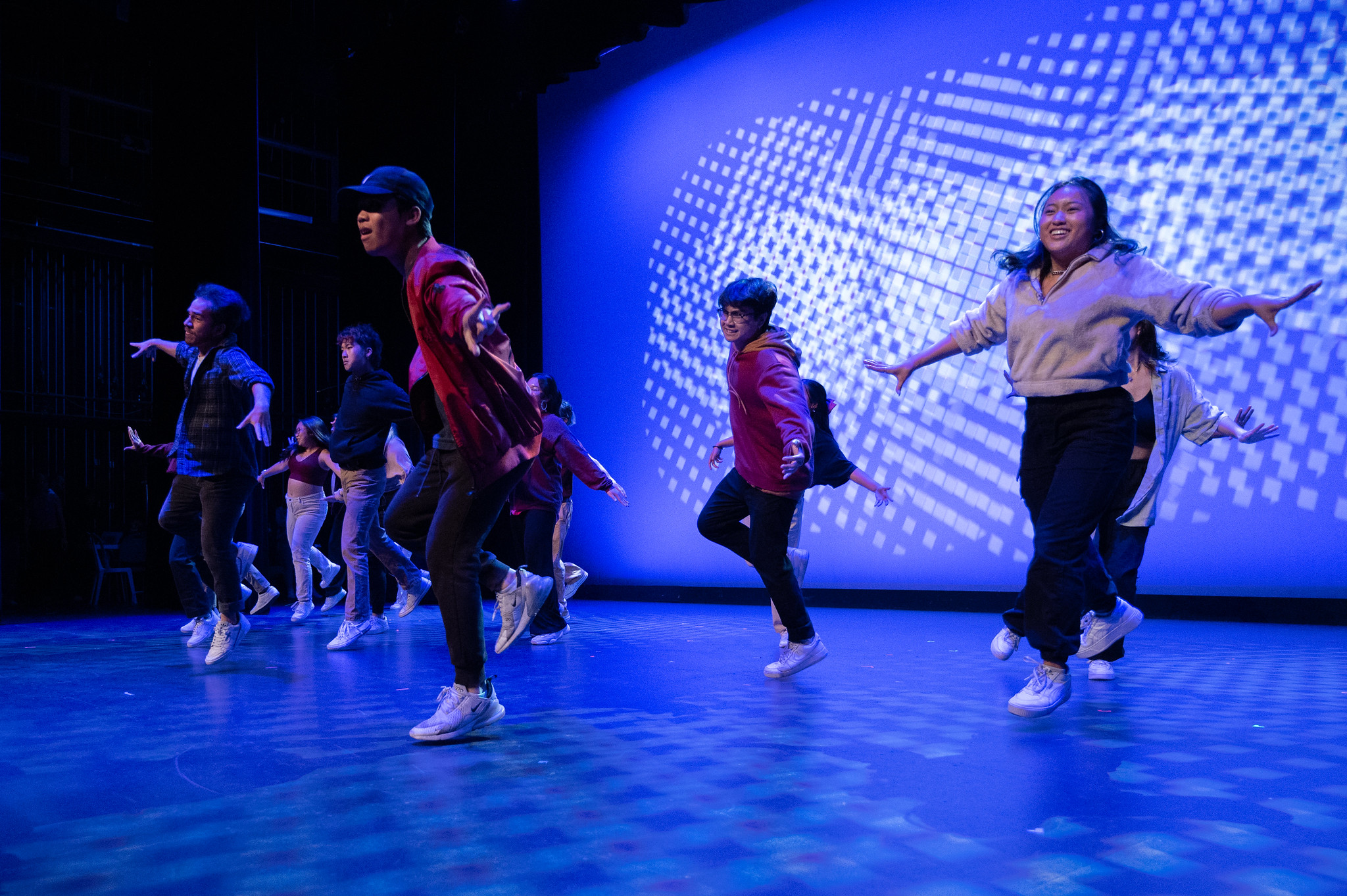 Hip-hop group dancing, photo captured them in mid-air.